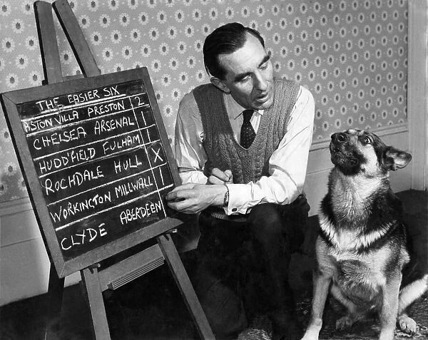 Bob Smith and Rita the 'Pools'dog. November 1958 P006442