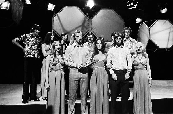 Bob Wilson and Charlie George in the front row of the chorus with Pan