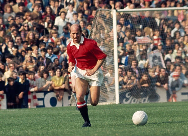Bobby Charlton in action for Manchester United during a league division one match gainst