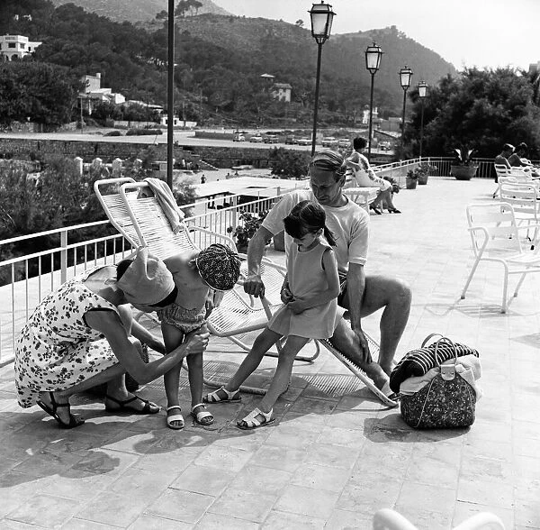 Bobby Charlton on holiday in Cala San Vicente, Majorca with his wife Norma