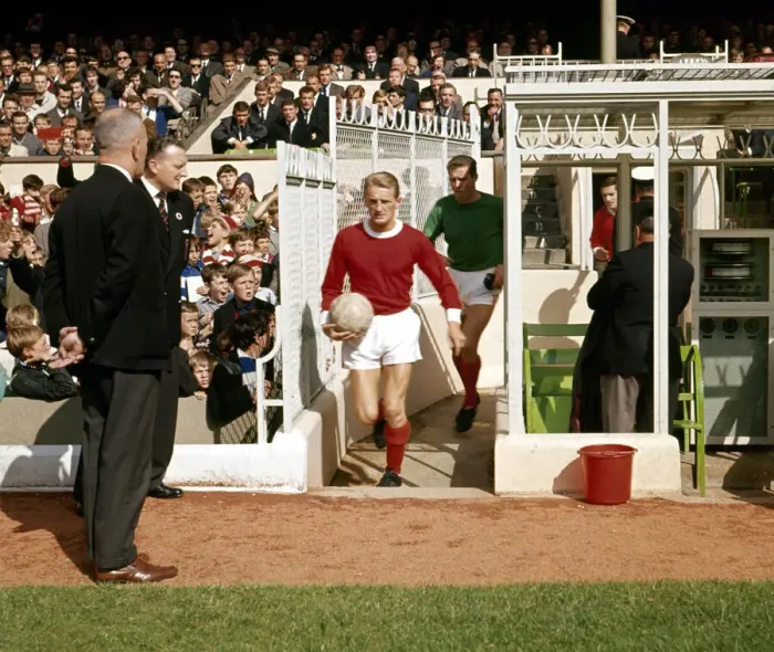 Framed Print : Bobby Charlton leads the Manchester United team out for a league division one match Framed Print : Bobby Charlton leads the Manchester United team out for a league division one match