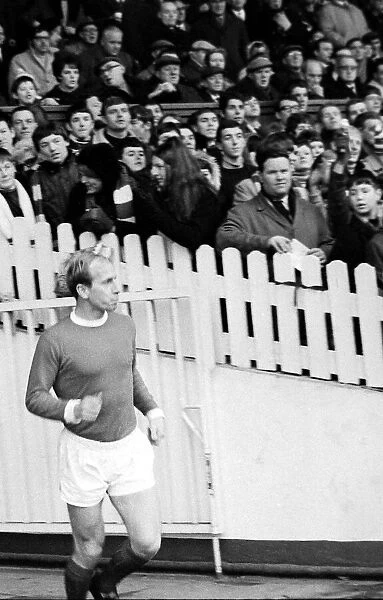 Bobby Charlton of Manchester United walk on to the pitch at old Trafford for the league