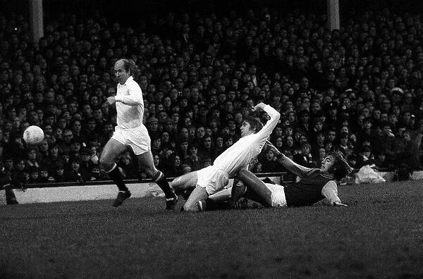 Bobby Charlton and Martin Buchan of Manchester United clear the ball from West Hams Billy