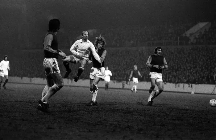 Framed Print : Bobby Charlton in mid air as he shoots for goal against West Ham at Upton Park during Framed Print : Bobby Charlton in mid air as he shoots for goal against West Ham at Upton Park during