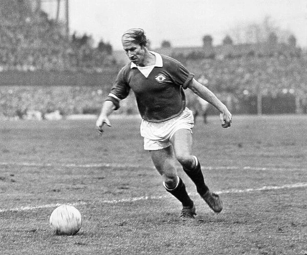 Bobby Charlton, playing for Manchester United in what would be his last season for