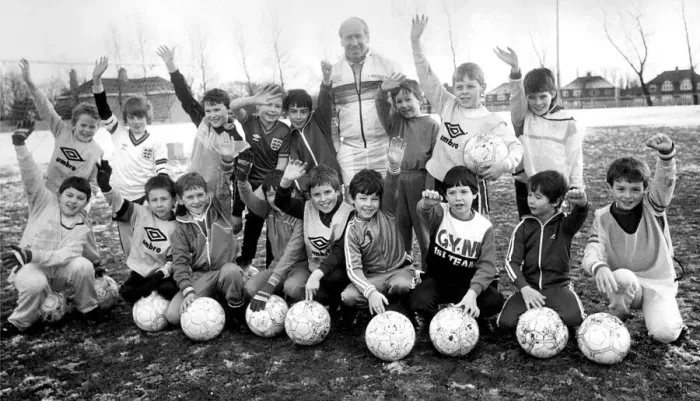 Framed Print : Bobby Charlton with youngsters at Soccer School at Monkton Stadium Framed Print : Bobby Charlton with youngsters at Soccer School at Monkton Stadium