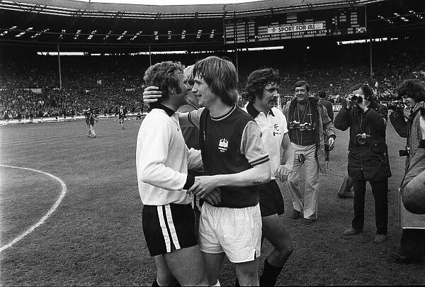 Bobby Moore is congratulated by Kevin Locke at Wembley after the 1975 FA Cup Final