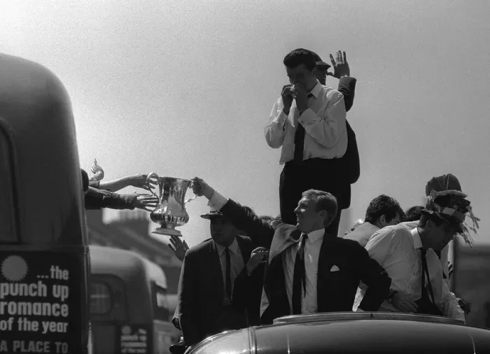 Framed Print : Bobby Moore holds up the FA Cup during the parade around East London after the Hammers