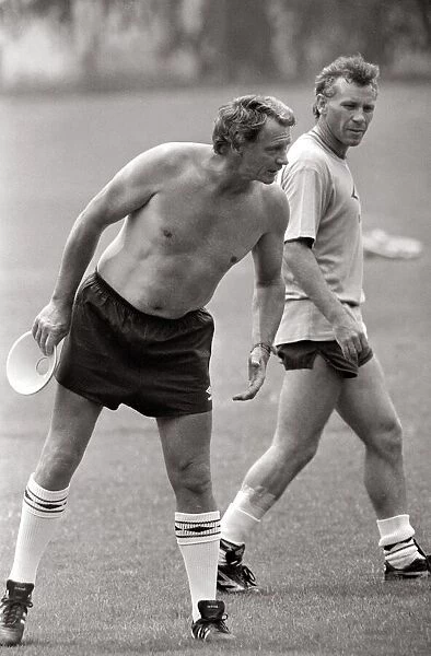 Bobby Robson England manager seen bare chested on the training ground during 1986 World