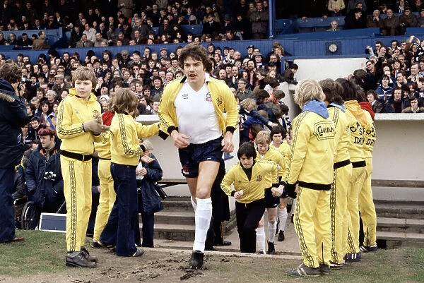 Bolton Wanderers captain Sam Allardyce leads his team out on to the pitch ahead of a