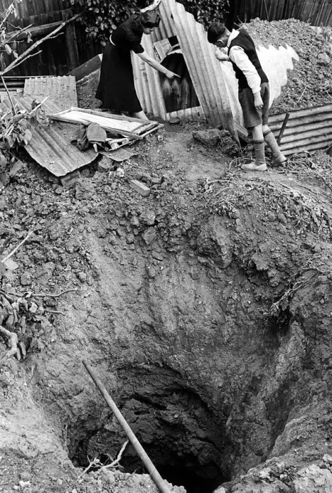 Framed Print : Bomb crater beside a garden shelter after an air raid on London 1940 WW2 Framed Print : Bomb crater beside a garden shelter after an air raid on London 1940 WW2
