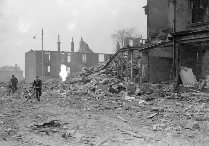 Framed Print : Bomb damage at Glasgow Clydeside, two boys runs for safety during the blitz