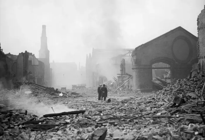 Framed Print : Bomb damage at Liverpool. Two people survey the damage caused by an air raid Framed Print : Bomb damage at Liverpool. Two people survey the damage caused by an air raid
