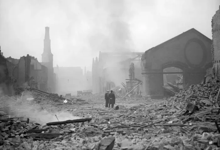 Framed Print : Bomb damage at Liverpool Two people survey the damage caused by the air raid Framed Print : Bomb damage at Liverpool Two people survey the damage caused by the air raid