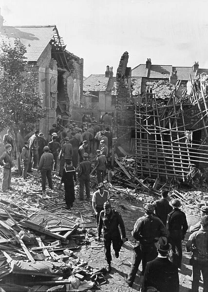 A bomb damage scene. Folkestone in Kent. The house is in ruins in the background