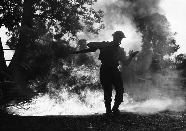 Bomber Command Battle School. (Picture) Airman crossing a fire trench