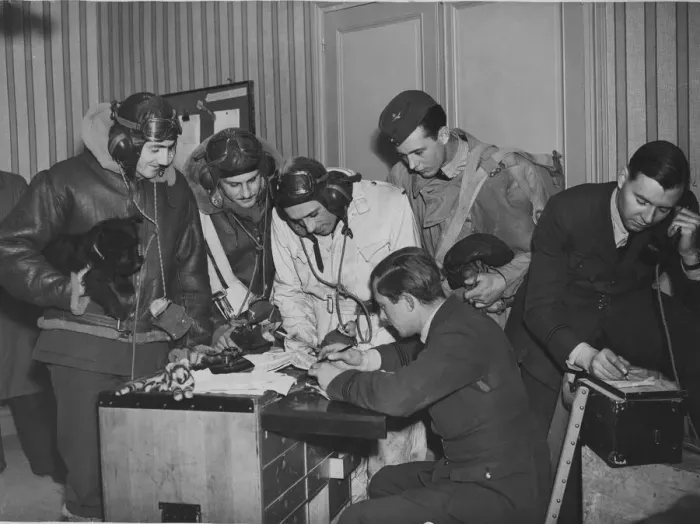Framed Print : Bomber crews receiving instructions in their squadron flight office, some where in France Framed Print : Bomber crews receiving instructions in their squadron flight office, some where in France