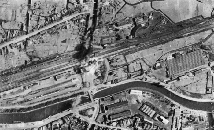 Framed Print : Bombs bursting on the railway station and sidings during a daylight attack by RAF Bomber Framed Print : Bombs bursting on the railway station and sidings during a daylight attack by RAF Bomber