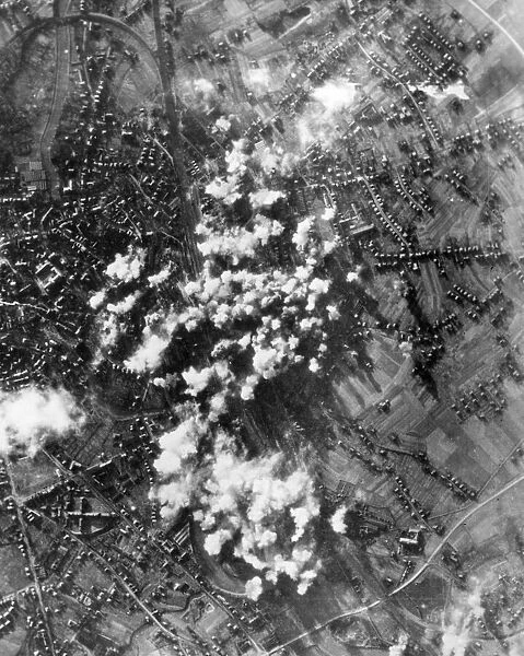 Bombs dropped by B-17 Flying Fortresses and B-24 Liberators explode onto choke points at