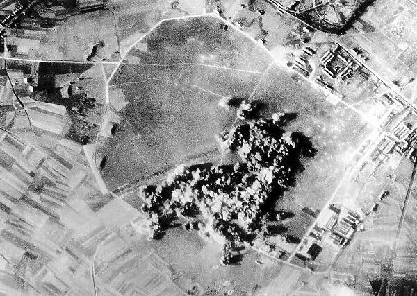 Bombs exploding on a Nazi aircraft engine plant near Brussels in Belgium
