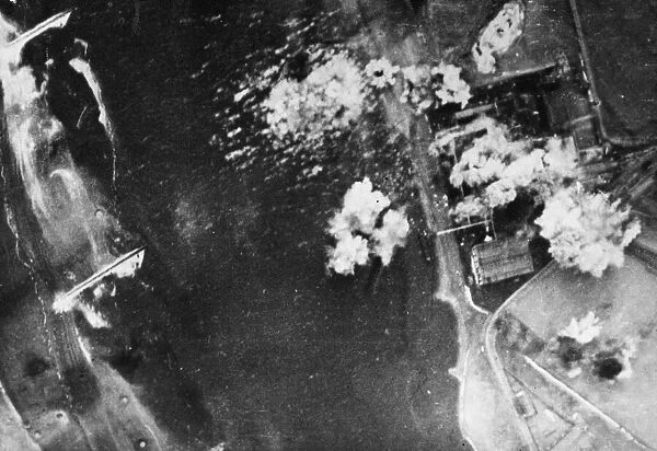 Bombs falling right across the target during the attack on the oil refinery