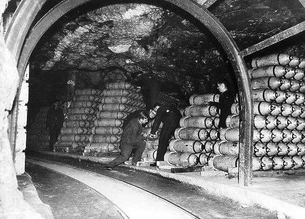 Bombs for the RAF are stockpiled in an underground tunnel before being transferred to