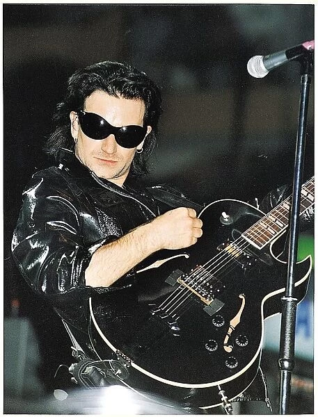 Bono of the pop group U2 performing on stage at Celtic Park in Glasgow during their ZOO