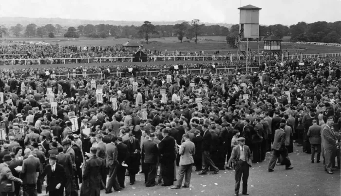 Framed Print : Bookies stands showing like little banners amongst the crowd at Newcastle