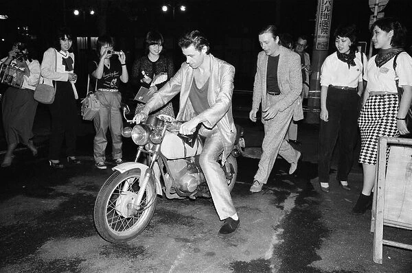 The Boomtown Rats in Tokyo. Pictured, singer Bob Geldof on a motorbike