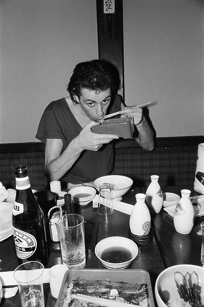 The Boomtown Rats in Tokyo. Pictured, singer Bob Geldof eating in a Japanese restaurant