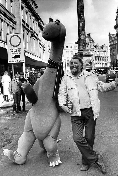 Botanist David Bellamy with a pink brontosaurus in Newcastle city centre on 26th March