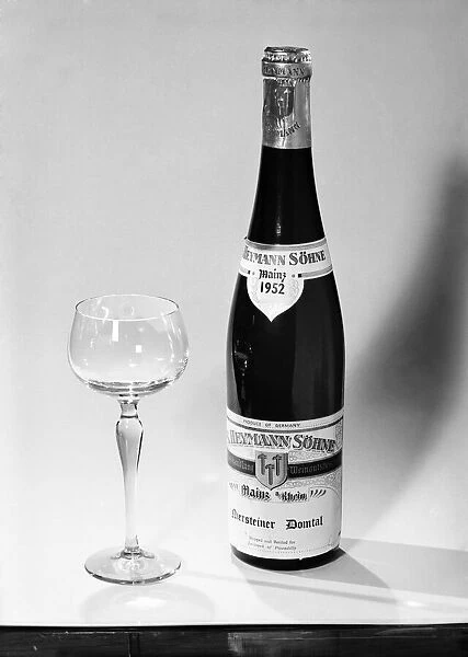 Bottles of wines and spirits with glasses. 1959 D69-003