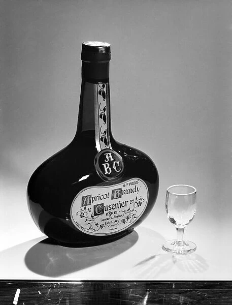 Bottles of wines and spirits with glasses. 1959 D69-010