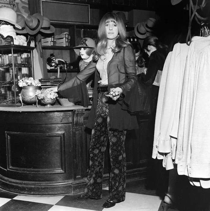 Framed Print : Boutique shop assistant Valerie Allen 19 holding flowers in the BIBA shop. London Framed Print : Boutique shop assistant Valerie Allen 19 holding flowers in the BIBA shop. London