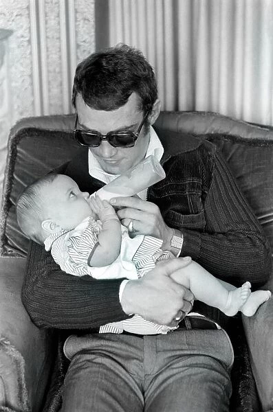 Boxer Alan Minter pictured at his Crawley Sussex home with his six month old baby