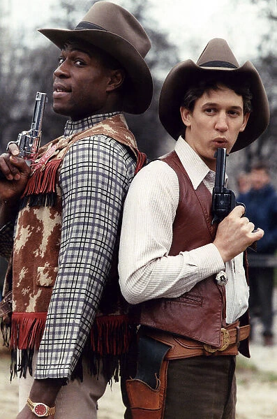 Boxer Frank Bruno and footballer Gary Lineker dressed in cowboy costume, December 1989