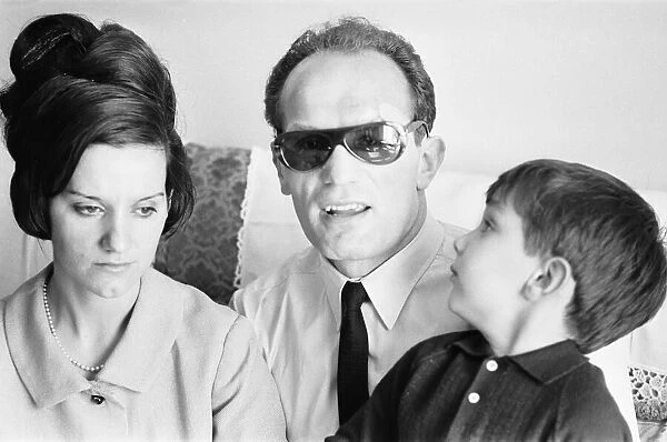 Boxer Henry Cooper seen here with his wife Albina and son following losing his fight with