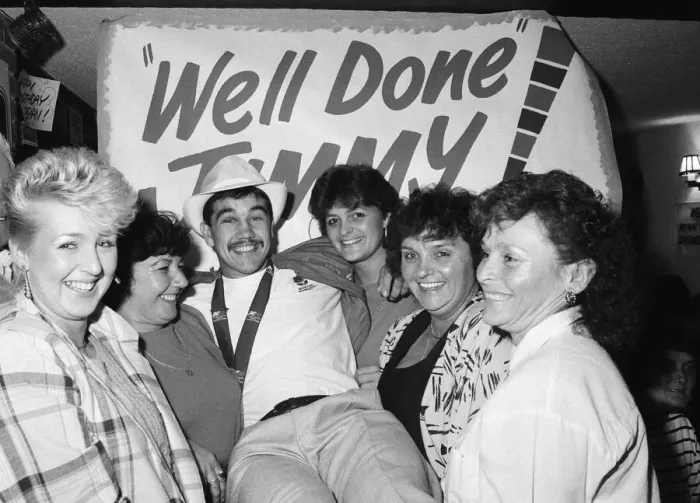 Framed Print : Boxer, Jimmy Moran celebrates his Commonwealth Games gold medal with friends at the Bell