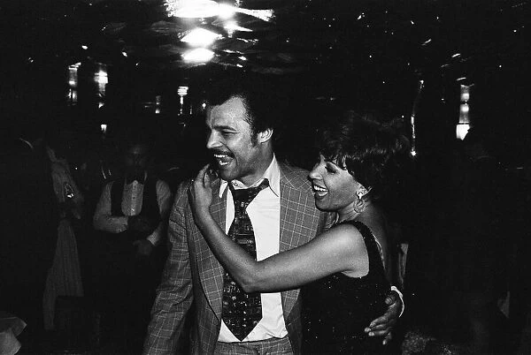 Boxer John Conteh dancing with Shirley Bassey at her party. 17th July 1979