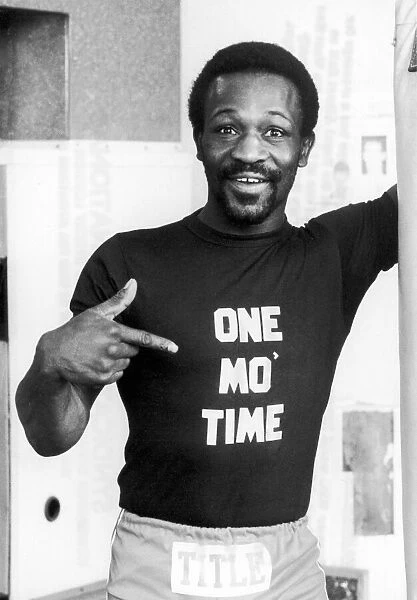 Boxer Maurice Hope wearing a t-shirt with a message for his opponent Reg Ford of Gyana