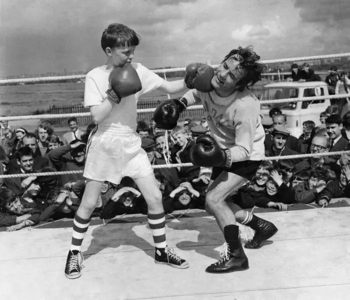 Framed Print : Boxer: Walter Mcgowan seen here in the ring during a training bout with a young admirer