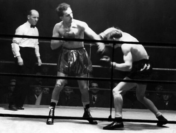 Boxers battle it out at St. James Hall, Newcastle. Stan Hawthorne standing