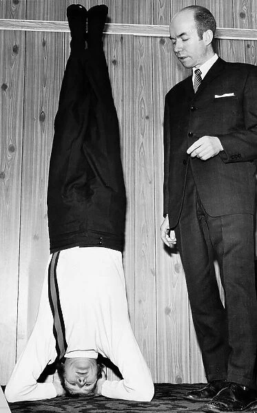 Boxing Boxer Jim Watt standing on his head