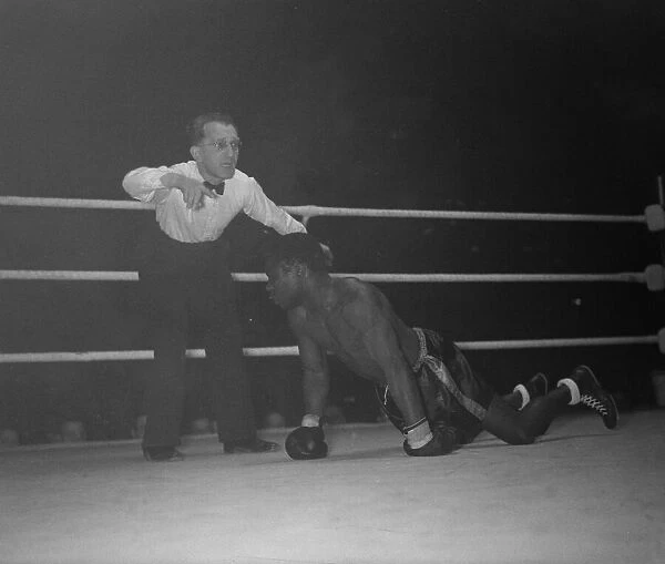 Boxing at Harringay 1951 Cliff Anderson tries to beat the count in the fight with