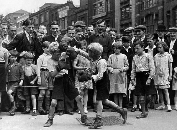 Boxing match in the street at Clerkenwell Green, a company of little boys arranged a