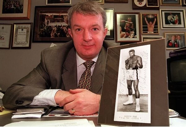 Boxing Promoter Tommy Gilmour December 1999 with a signed print of Mohammed Ali