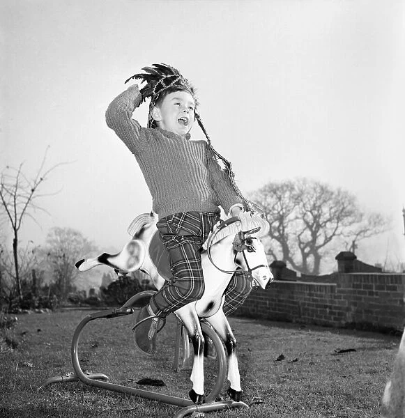 A boy and his best friend. Peter Hallett aged 4 seen here playing cowboys