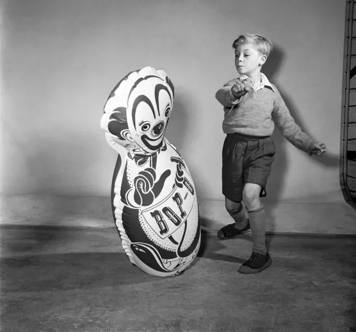 Framed Print : Boy boxing a toy punch bag. December 1953 D7218 Framed Print : Boy boxing a toy punch bag. December 1953 D7218