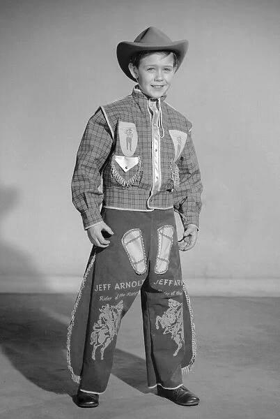 Boy dressed as cowboy Jeff Arnold for a Reveille feature on dressing up 2nd December