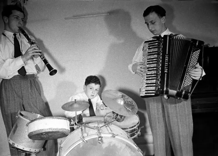 Framed Print : Boy musician Victor Feldman on his drum kit with band members playing the clarinet